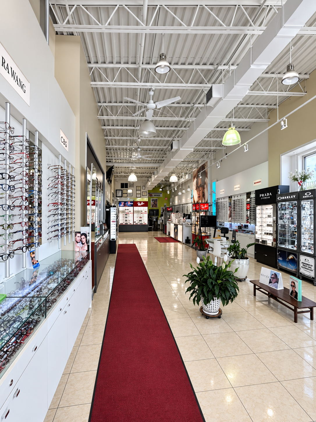 Long interior aisle with eyewear displays at Optical Trust